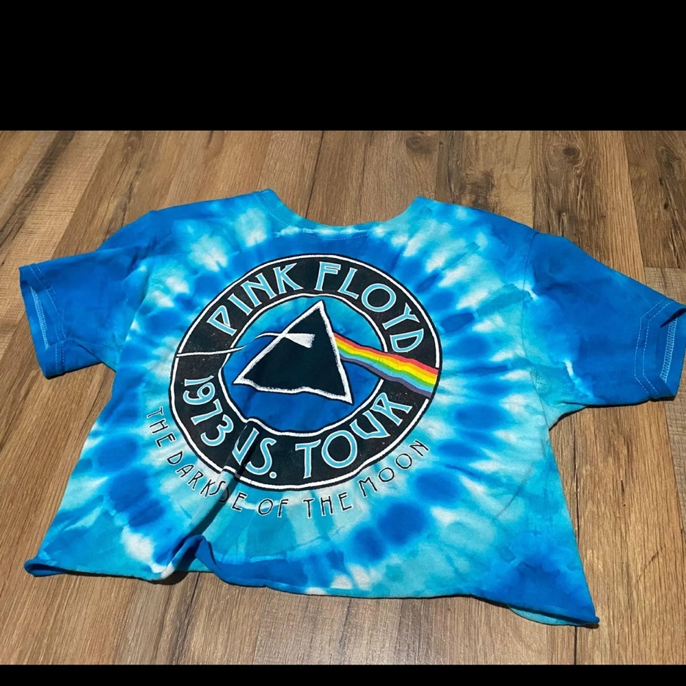 This is a pink floyd shirt that has been cut to be a crop top. Barely worn